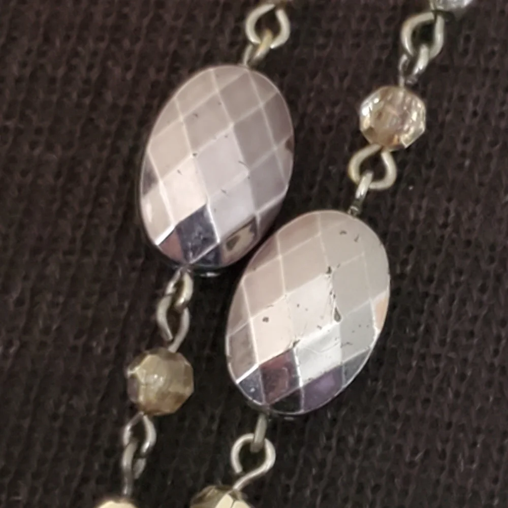 Silvertone and black bead and geometric stations necklace